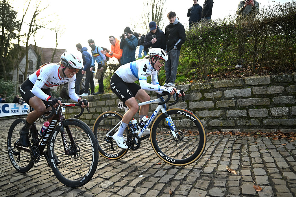 NIVONE, BELGIUM - FEBRUARY 28: (L-R) Kasia Niewiadoma of Poland and Team Canyon-SRAM and Demi Vollering of Netherlands and Team FDJ United - SUEZ compete in the breakaway passing through the Muur - Kapelmuur cobblestones sector during the 21st Omloop Het Nieuwsblad 2026, Women&amp;apos;s Elite a 137.2km one day race from Ghent to Ninove / #UCIWWT / on February 28, 2026 in Ninove, Belgium. (Photo by Luc Claessen/Getty Images)