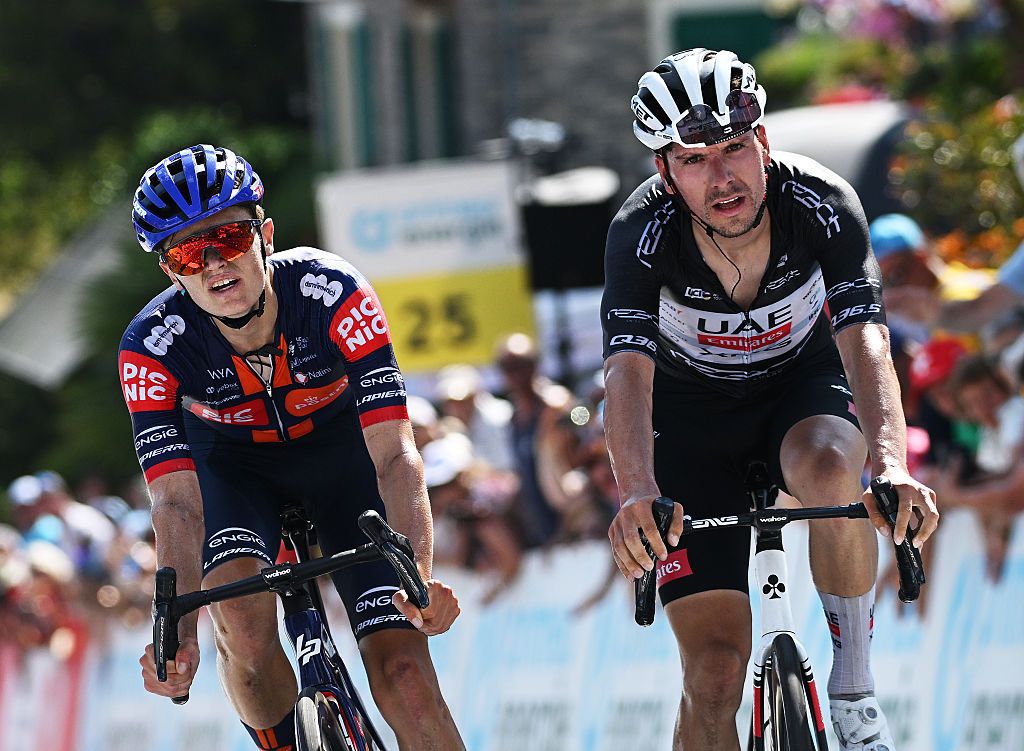 SANTA MARIA IN CALANCA, SWITZERLAND - JUNE 19: (L-R) Oscar Onley of Great Britain and Team Picnic PostNL reacts as stage winner ahead of Joao Almeida of Portugal and UAE Team Emirates - XRG - Black Points Jersey during the 88th Tour de Suisse, Stage 5 a 183.8km stage from La Punt to Santa Maria in Calanca 941m / #UCIWT / on June 19, 2025 in Santa Maria in Calanca, Switzerland. (Photo by Tim de Waele/Getty Images)