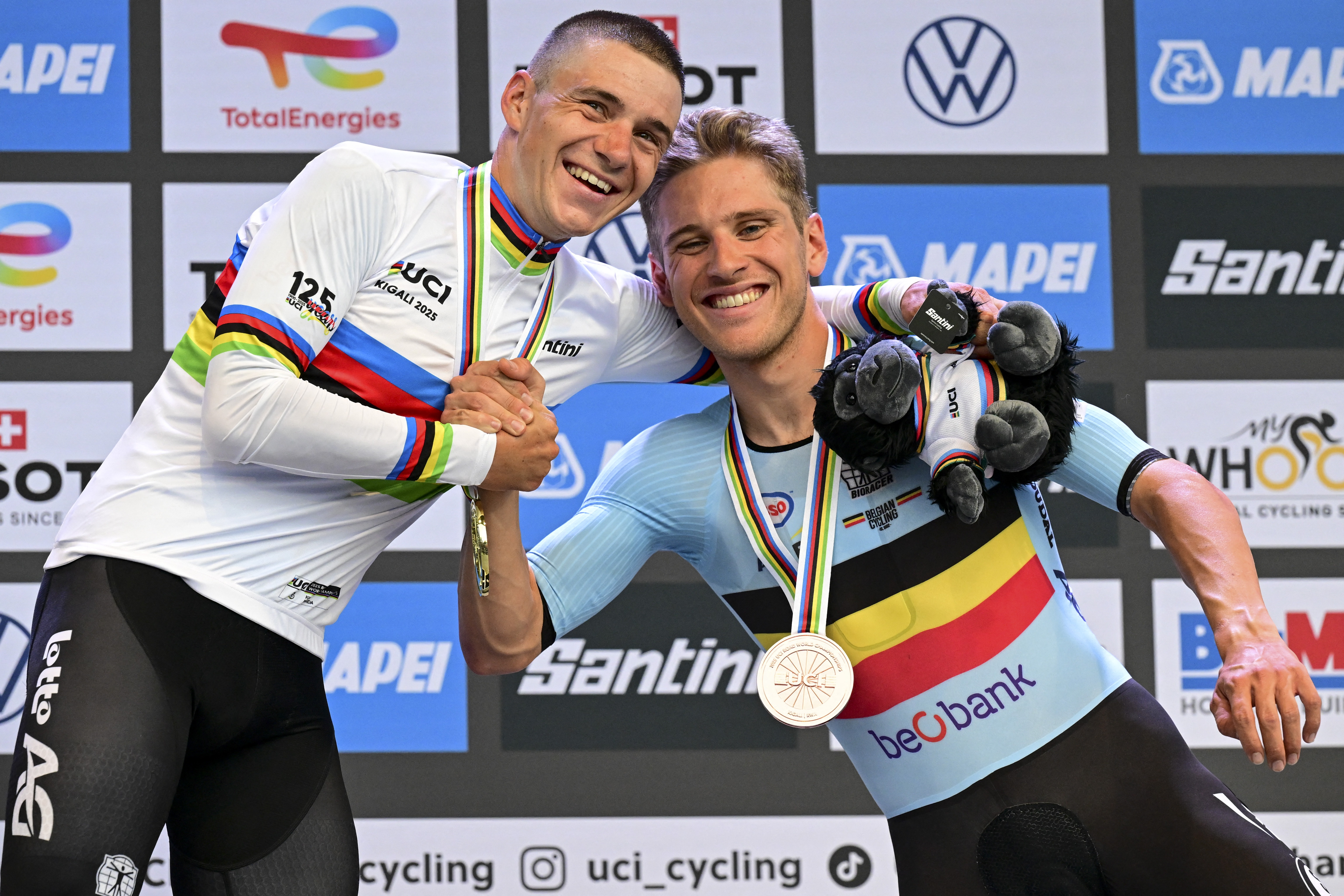 Gold medal winner world champion Belgian Remco Evenepoel and bronze medalist Belgian Ilan van Wilder pictured on the podium of the Men Elite Individual Time Trial race (40,8km) at the cycling road world championships, in Kigali, Rwanda, Sunday 21 September 2025. The 2025 UCI Road World Championships take place from 21 to 28 September in Kigali, Rwanda. BELGA PHOTO DIRK WAEM (Photo by DIRK WAEM / BELGA MAG / Belga via AFP) (Photo by DIRK WAEM/BELGA MAG/AFP via Getty Images)