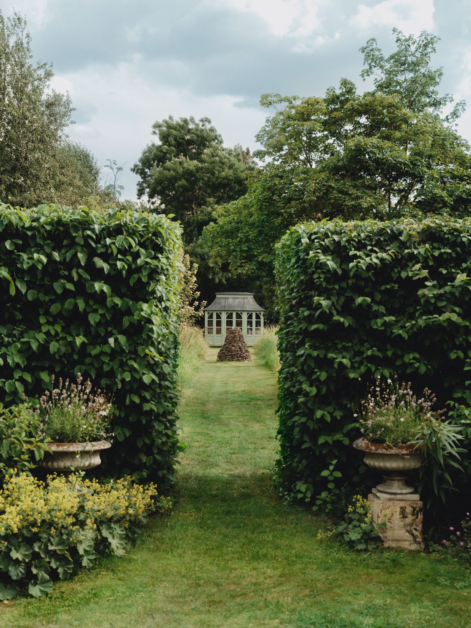 Image may contain Garden Nature Outdoors Arbour Architecture Building Housing Plant Vegetation House and Backyard