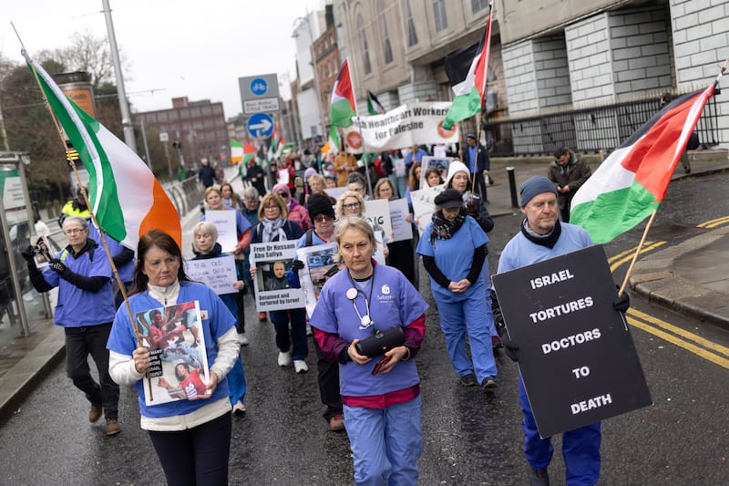 Dr Angela Skuse (centre) and Irish healthcare workers lead a silent memorial walk in solidarity with colleagues in Gaza. Photograph: Chris Maddaloni