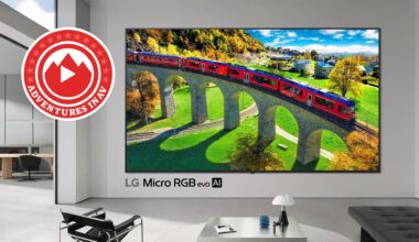 A huge LG flastcreen TV, mounted on the wall of a fancy apartment.