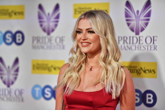 Lucy Fallon smiling in a red dress at the Pride of Britain Awards 2022.