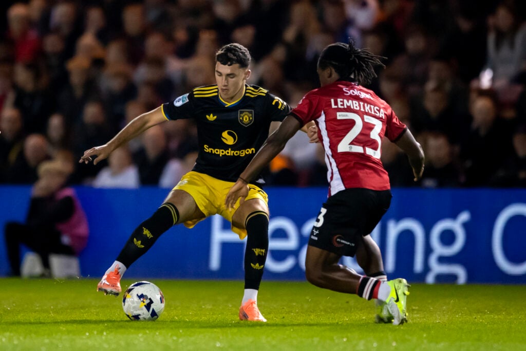 James Scanlon playing for Man Utd under-21s, black kit