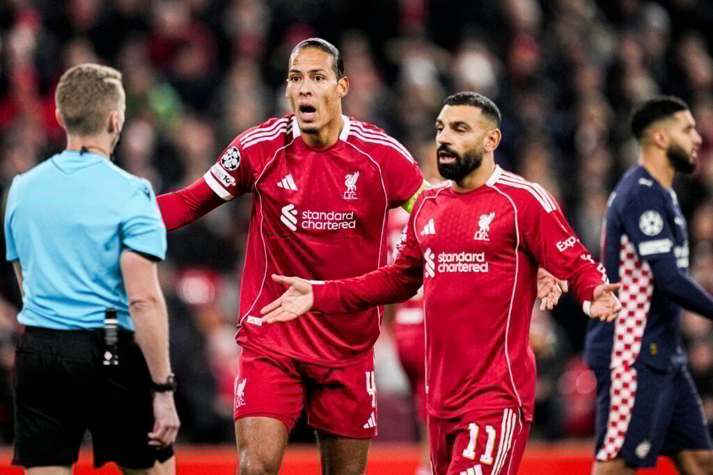 Virgil van Dijk and Mohamed Salah appeal to the referee during Liverpool's UEFA Champions League match against PSV Eindhoven at Anfield.