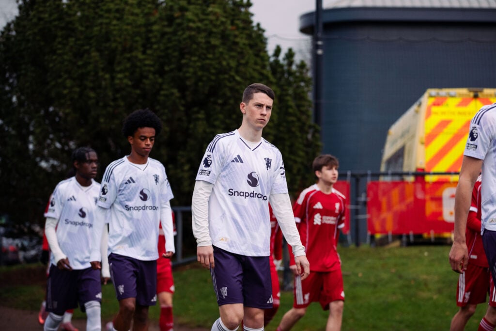 Jay McEvoy in white Manchester United third kit.