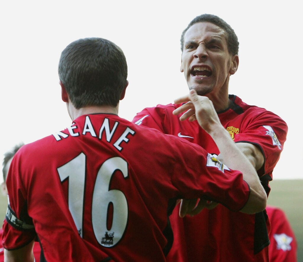 Rio Ferdinand celebrates with Roy Keane