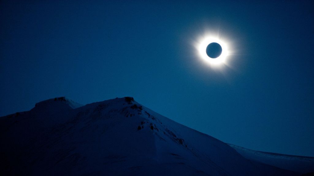 A total solar eclipse can be seen in Svalbard, Longyearbyen, Norway, on March 20, 2015. Sun appears as a black spot with bright white halo around it.