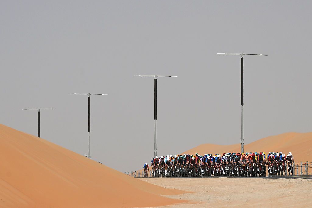 ABU DHABI, UNITED ARAB EMIRATES - FEBRUARY 16: A general view of the peloton passing through a landscape during the 8th UAE Tour 2026, Stage 1 a 144km stage from Madinat Zayed Majlis to Liwa Palace on February 16, 2026 in Abu Dhabi, United Arab Emirates.