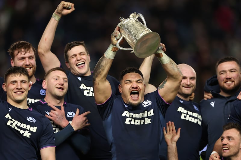 Scotland captain Sione Tuipulotu lifts the Calcutta Cup after their win over England. Photograph: Stu Forster/Getty Images