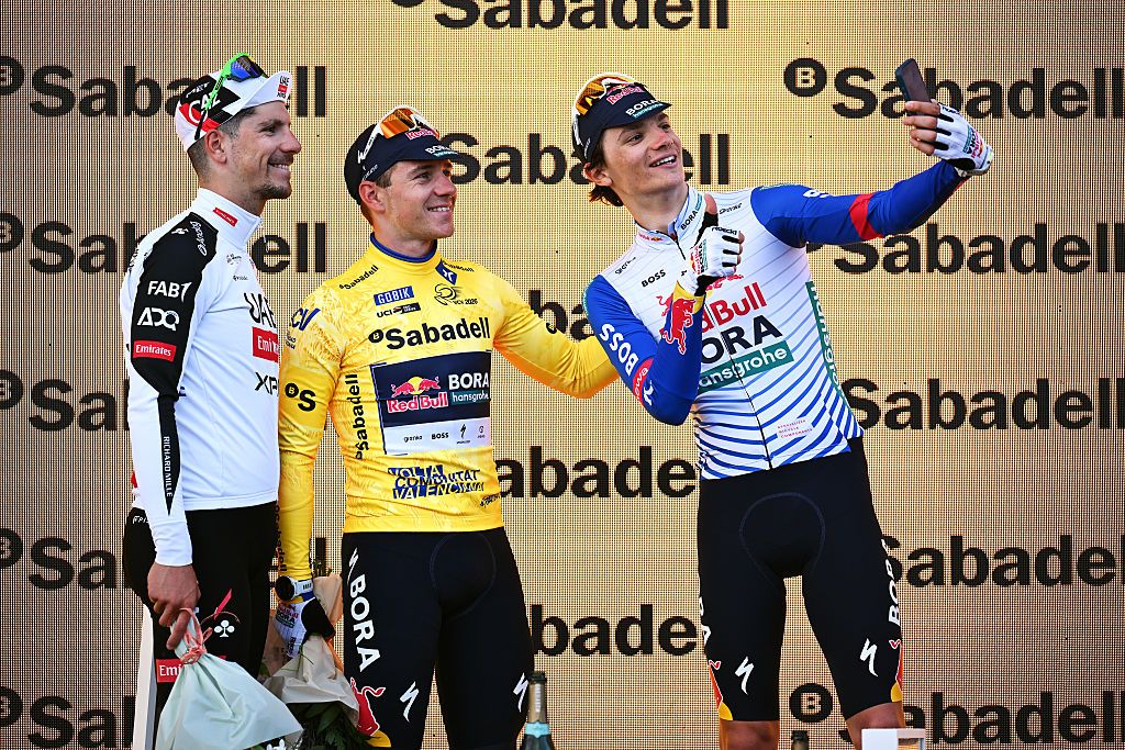 VALENCIA, SPAIN - FEBRUARY 08: (L-R) Joao Almeida of Portugal UAE Team Emirates - XRG on second place, race winner Remco Evenepoel of Belgium and Team Red Bull - BORA - hansgrohe and Giulio Pellizzari of Italy and Team Red Bull - BORA - hansgrohe on third place pose on the podium ceremony after the 77th Volta Comunitat Valenciana 2026, Stage 5 a 94.7km stage from Betera to Valencia on February 08, 2026 in Valencia, Spain. (Photo by Szymon Gruchalski/Getty Images)