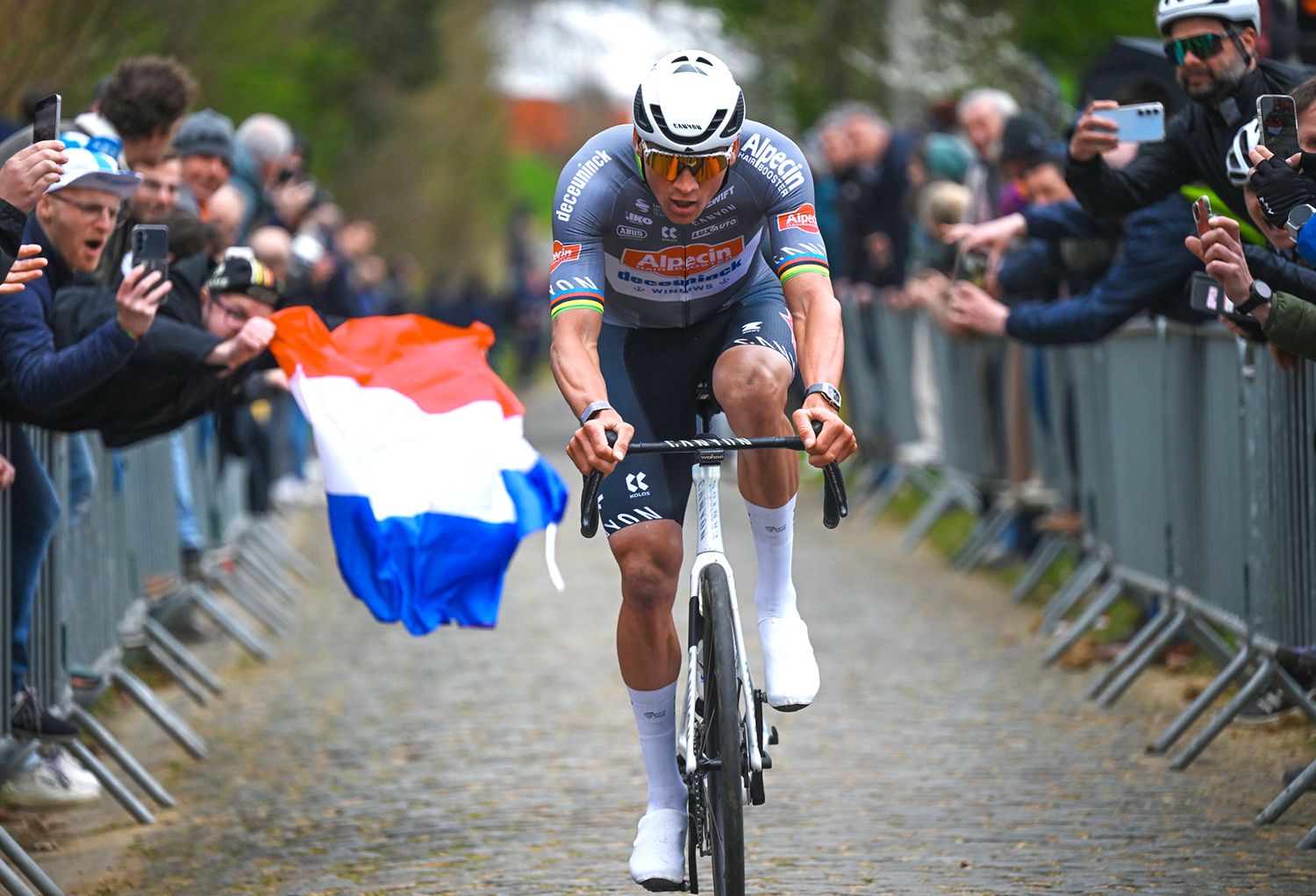 HARELBEKE, BELGIUM - MARCH 28: Race winner Mathieu Van Der Poel of Netherlands and Team Alpecin - Deceuninck competes passing through the Oude Kwaremont cobblestones sector while fans cheer during the 68th E3 Saxo Bank Classic - Harelbeke 2025 a 208.8km one day race from Harelbeke to Harelbeke / #UCIWT / on March 28, 2025 in Harelbeke, Belgium. (Photo by Tim de Waele/Getty Images)