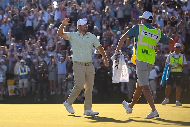 Chris Gotterup celebrates with his caddie after winning the WM Phoenix Open in Scottsdale, Arizona, on Sunday. Photograph: Alex Goodlett/Getty Images