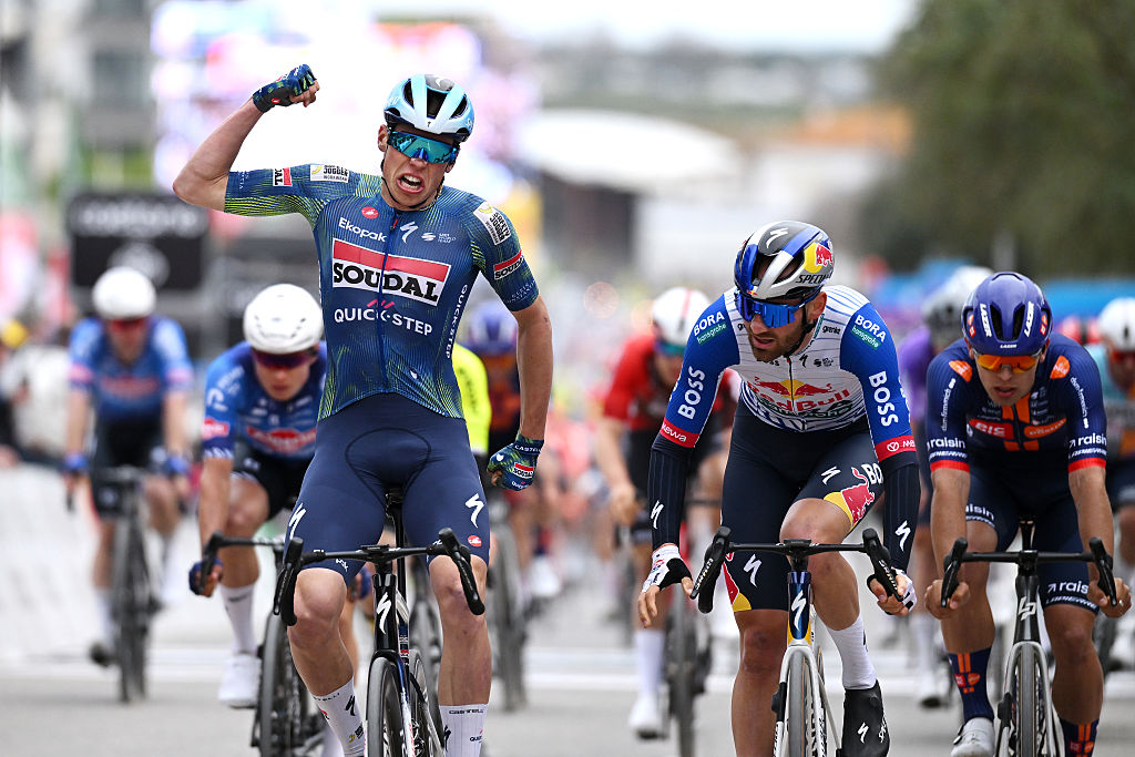 TAVIRA, PORTUGAL - FEBRUARY 18: (L-R) Paul Magnier of France and Team Soudal Quick-Step celebrates at finish line as stage winner ahead of Jordi Meeus of Belgium and Team Red Bull - BORA - hansgrohe and Pavel Bittner of Czech Republic and Team Picnic PostNL during the 52nd Volta ao Algarve em Bicicleta 2026 - Stage 1 a 183.5km stage from Vila Real de Santo Antonio to Tavira on February 18, 2026 in Tavira, Portugal. (Photo by Dario Belingheri/Getty Images)