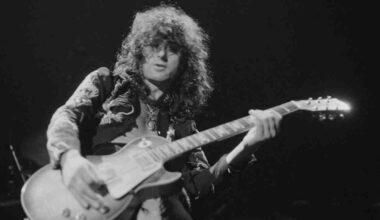 Jimmy Page performing onstage in the 1970s