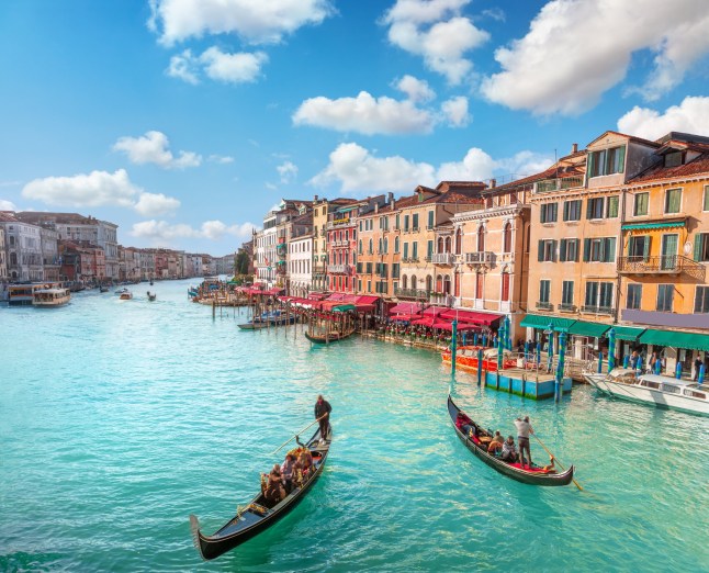 Grand canal on sunny day in Venice, Italy; Shutterstock ID 2438842983; purchase_order: -; job: -; client: -; other: -