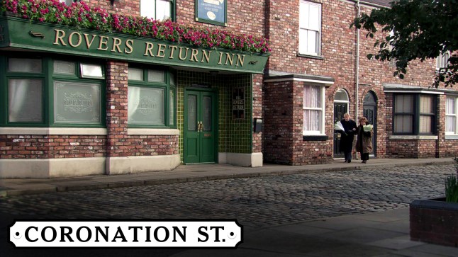 The Coronation Street logo, placed over a scene of the cobbled street and the closed Rovers Return Inn pub.