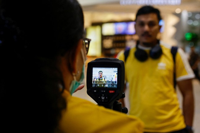 A passenger is checked with a thermal imager at Soekarno Hatta International Airport, following the implementation of health screening for arriving passengers, after India confirmed two cases of the deadly Nipah virus, in Tangerang near Jakarta, Indonesia, January 30, 2026. REUTERS/Ajeng Dinar Ulfiana