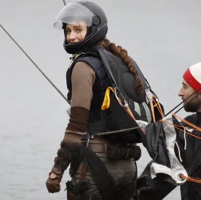 6 February 2026 - EXCLUSIVE. SOPHIE'S BIG RAID! Sophie Turner was spotted for the first time stepping into the role of legendary adventurer Lara Croft as filming got underway on the new Tomb Raider. The actress made a dramatic entrance, parachuting onto a beach during the opening scenes, while cameras rolled on location in Surrey, UK. But it wasn't quite Hollywood sunshine, as Turner was seen battling the British weather with rain pouring down over the set, soaking the cast and crew as filming continued regardless. The reboot is penned by Phoebe Waller-Bridge, with the action-packed scenes offering the first tantalising glimpse of Sophie's take on the iconic video-game heroine. Credit: CLICK NEWS AND MEDIA Ref: Dandef **Exclusive to CLICK NEWS AND MEDIA** CLICK NEWS AND MEDIA - PICTURES@CLICKNEWSANDMEDIA.COM - 07774 321240 -