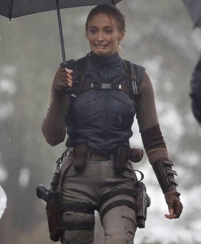 6 February 2026 - EXCLUSIVE. SOPHIE'S BIG RAID! Sophie Turner was spotted for the first time stepping into the role of legendary adventurer Lara Croft as filming got underway on the new Tomb Raider. The actress made a dramatic entrance, parachuting onto a beach during the opening scenes, while cameras rolled on location in Surrey, UK. But it wasn't quite Hollywood sunshine, as Turner was seen battling the British weather with rain pouring down over the set, soaking the cast and crew as filming continued regardless. The reboot is penned by Phoebe Waller-Bridge, with the action-packed scenes offering the first tantalising glimpse of Sophie's take on the iconic video-game heroine. Credit: CLICK NEWS AND MEDIA Ref: Dandef **Exclusive to CLICK NEWS AND MEDIA** CLICK NEWS AND MEDIA - PICTURES@CLICKNEWSANDMEDIA.COM - 07774 321240 -