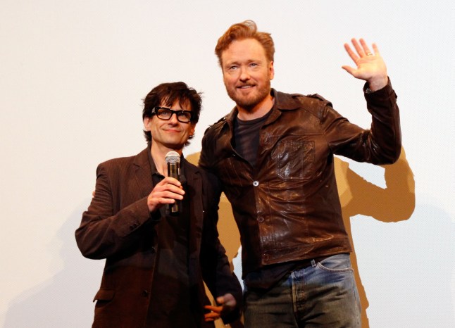 AUSTIN, TX - MARCH 13: Director Rodman Flender and TV personality Conan O'Brien speak onstage at the 2011 SXSW Music, Film + Interactive Festival "Conan O'Brien Can't Stop" Premiere at Paramount Theater on March 13, 2011 in Austin, Texas. (Photo by Scott Melcer/WireImage)