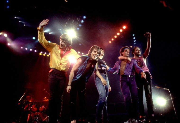 American rock band Journey, left to right, bassist Ross Valory, singer Steve Perry, drummer Steve Smith, guitarist Jonathan Cain, and guitarist Neal Schon acknowledge the audience after performing at the Rosemont Horizon in Rosemont, Illinois, June 10, 1983. (Photo by Paul Natkin/Getty Images)