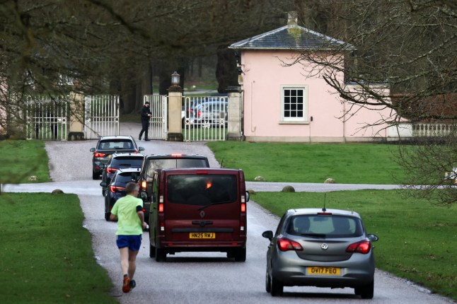 A convoy with police officers, travels into the Royal Lodge, after Andrew Mountbatten-Windsor, younger brother of Britain's King Charles, formerly known as Prince Andrew, was released following arrest on suspicion of misconduct in public office on Thursday, after the U.S. Justice Department released more records tied to the late financier and convicted sex offender Jeffrey Epstein, in Windsor, Britain, February 21, 2026. REUTERS/Jack Taylor