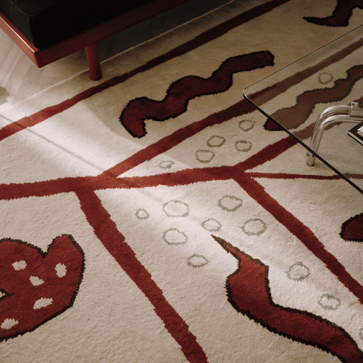 Nordic Knots rug Walled Garden in Beige shown in a rotating gif as a close-up detail and a product image against a pale cream background.