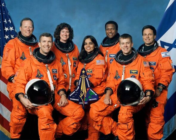 The seven astronauts who died on Space Shuttle Columbia wearing their orange space suits The seven astronauts who died on Space Shuttle Columbia wearing their orange space suits