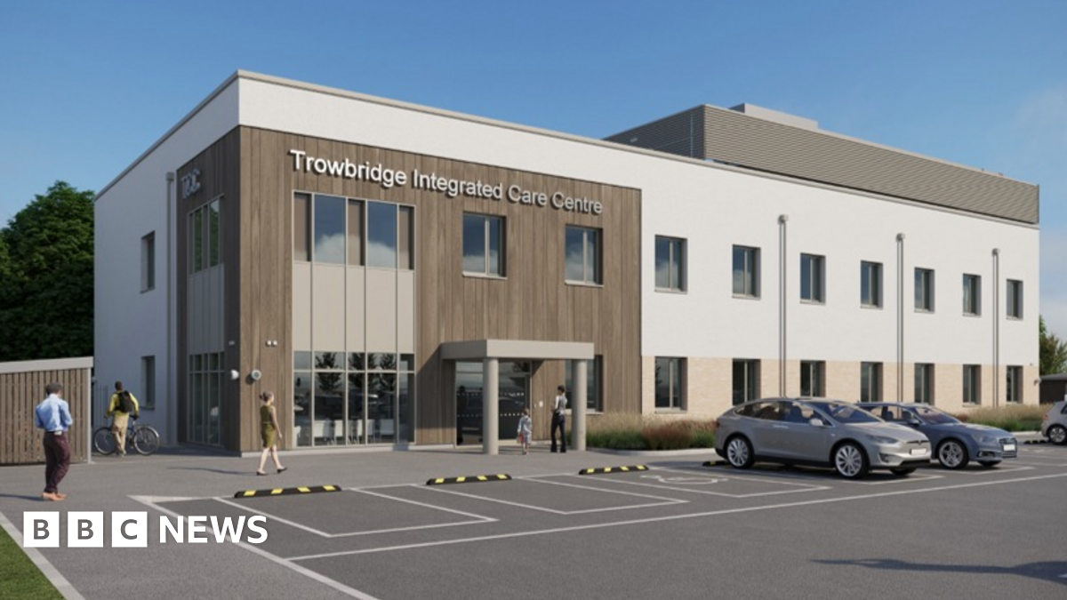 A mock-up of a building which says 'Trowbridge Integrated Care Centre' and has cars parked outside.