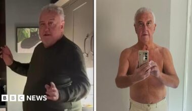 A composite image showing an overweight man wearing a dark-coloured top on the left side and the same man topless holding a mobile phone and wearing beige trousers on the right side.