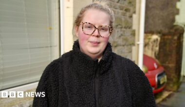 A woman in a black fleece and glasses