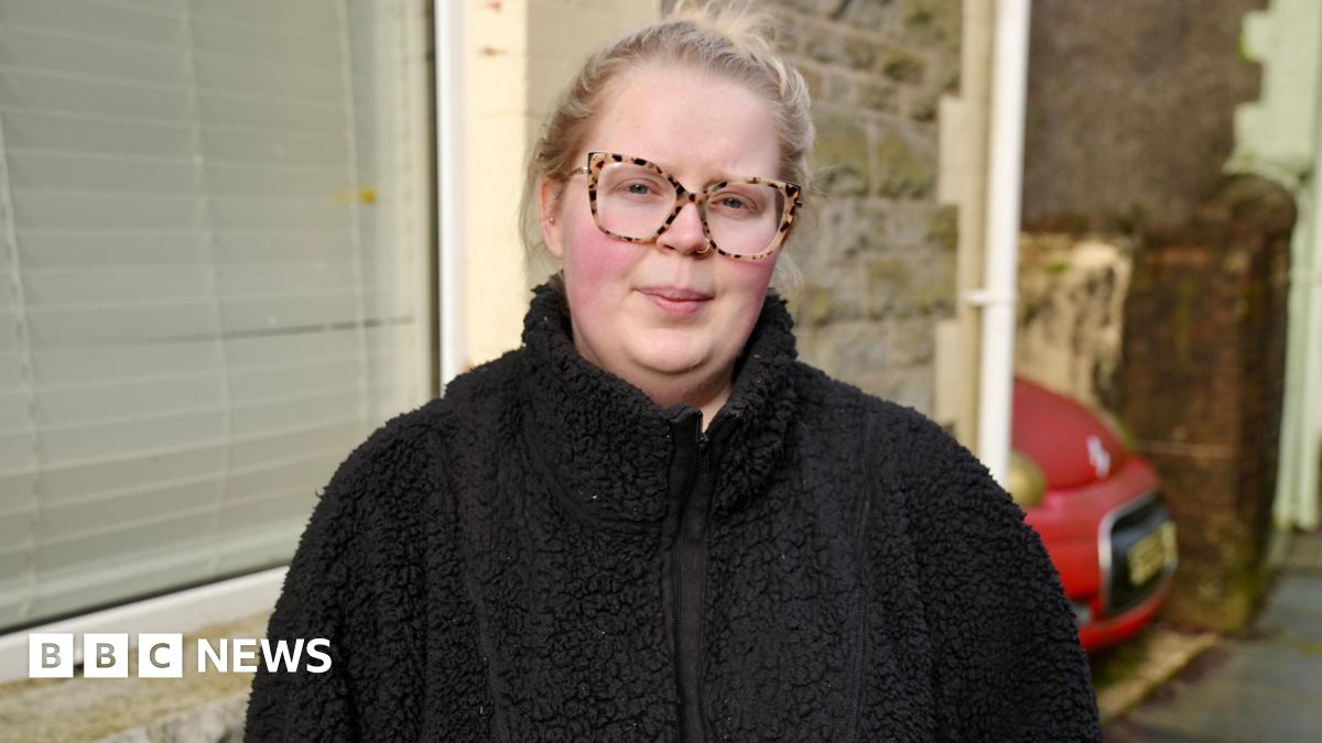 A woman in a black fleece and glasses