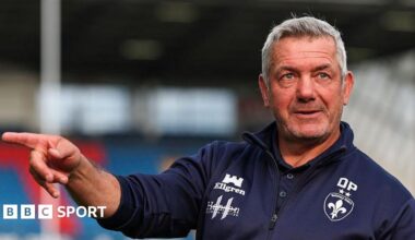 Daryl Powell directs training in a blue Wakefield Trinity top