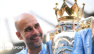 Pep Guardiola holds up six fingers to fans to indicate the six Premier League titles won after their match with Liverpool in December 2024