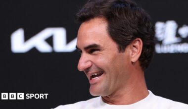 Roger Federer laughs during a news conference at the 2026 Australia Open