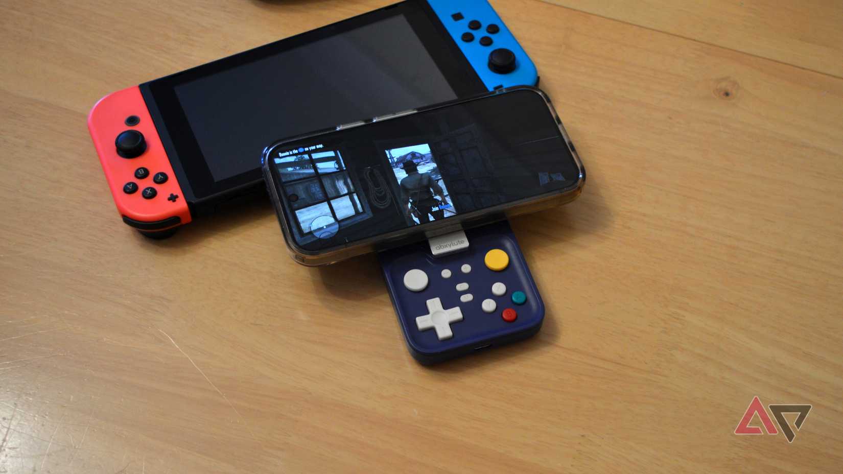 The Abxylute M4 resting on a Nintendo Switch, with Red Dead Redemption being played.