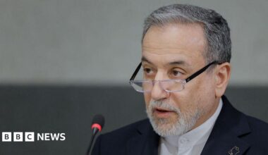A headshot of Abbas Araghchi as he speaks into a microphone.
