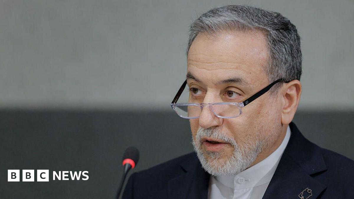 A headshot of Abbas Araghchi as he speaks into a microphone.