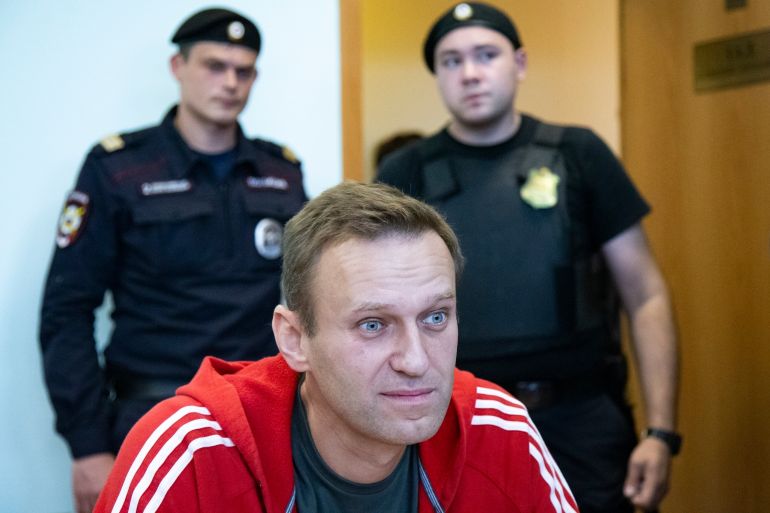 FILE - In this Aug. 22, 2019, file photo, Russian opposition leader Alexei Navalny speaks to the media prior to a court session in Moscow, Russia. (AP Photo/Alexander Zemlianichenko, File)