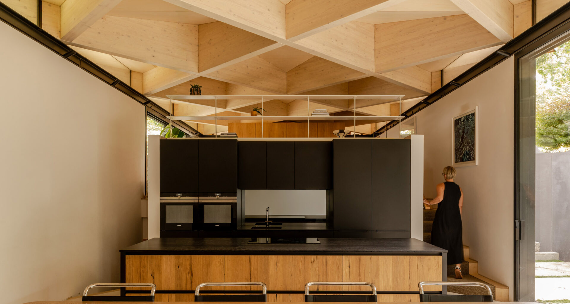 Kitchen with exposed timber diagrid roof in Arbour House by Andrei Saltykov