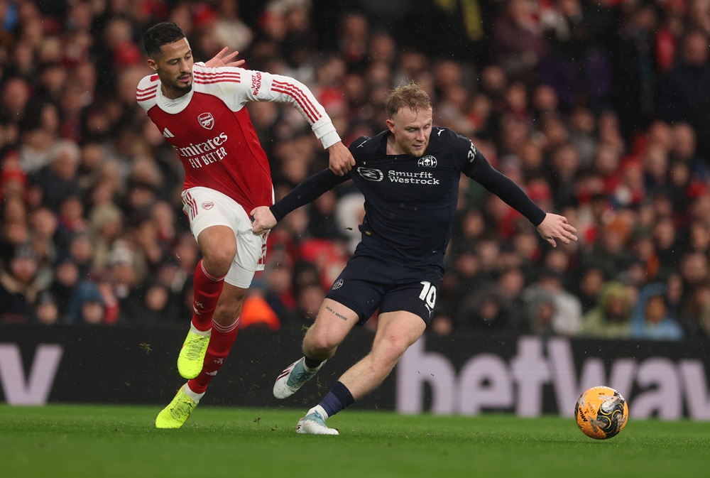 William Saliba of Arsenal and Joe Taylor of Wigan Athletic during the Emirates FA Cup Fourth Round match between Arsenal and Wigan Athletic on Febr...