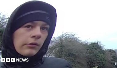 A police mugshot of Kian Moulton, who has dark brown hair, which is curly on top