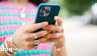 A close-up of a woman using a smartphone