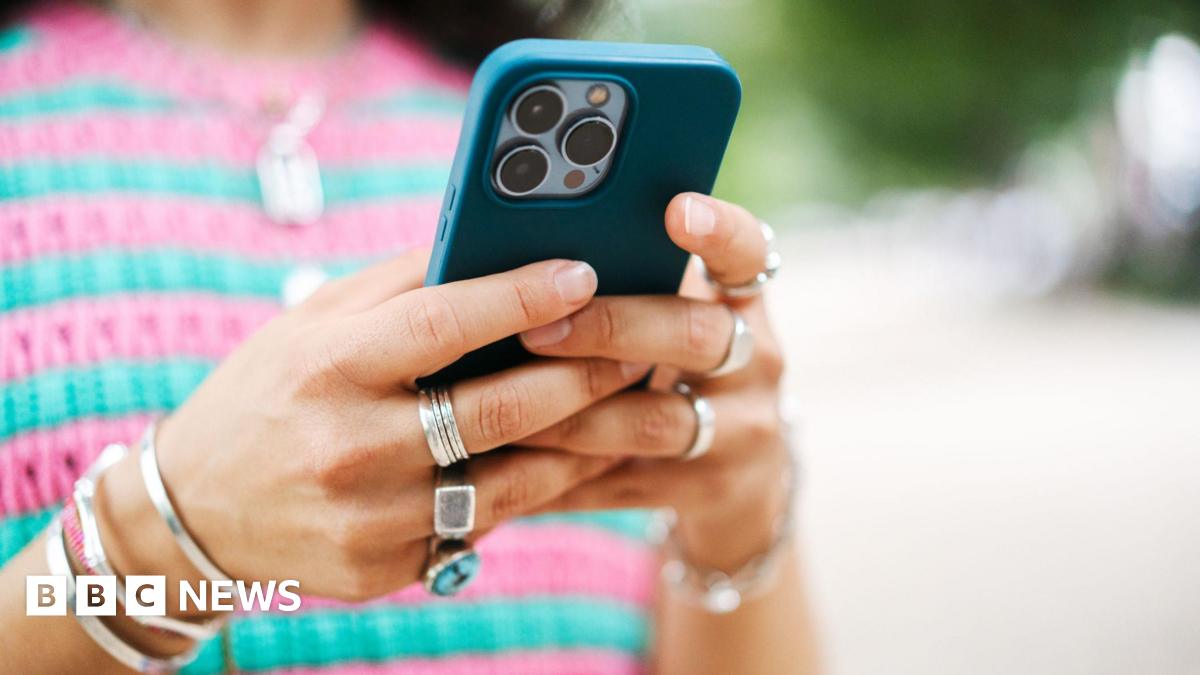 A close-up of a woman using a smartphone