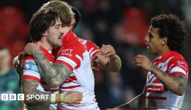 St Helens forward Joe Shorrocks is congratulated on his try against Leigh Leopards by team-mates.