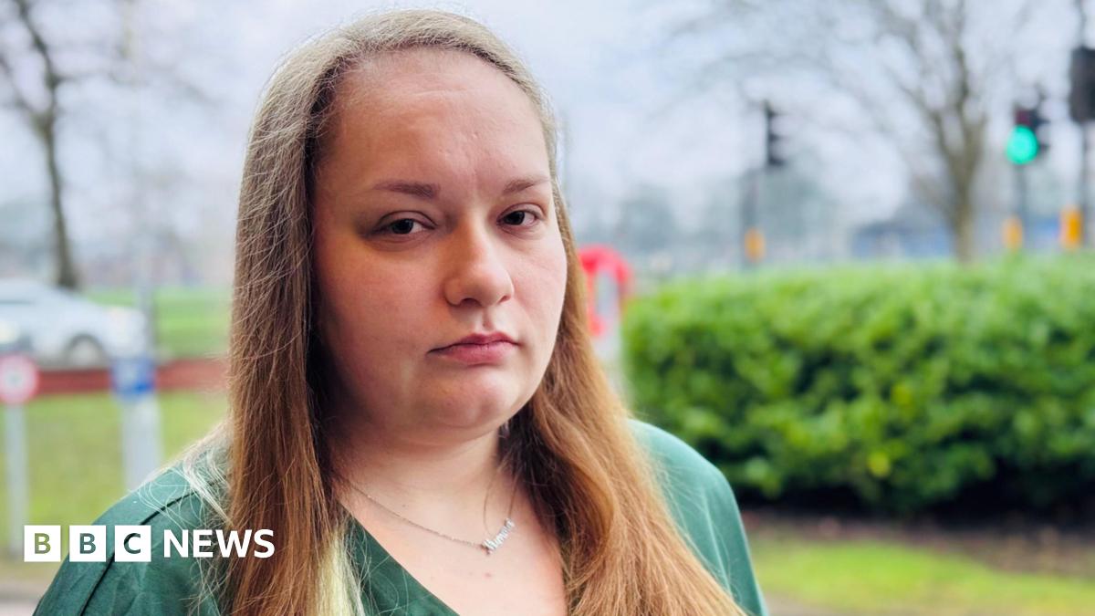 Georgia's wrist, which appears to have been recently operated on. It appears to be resting on a hospital bed. It shows a large scar and evidence of stitches and dried blood.