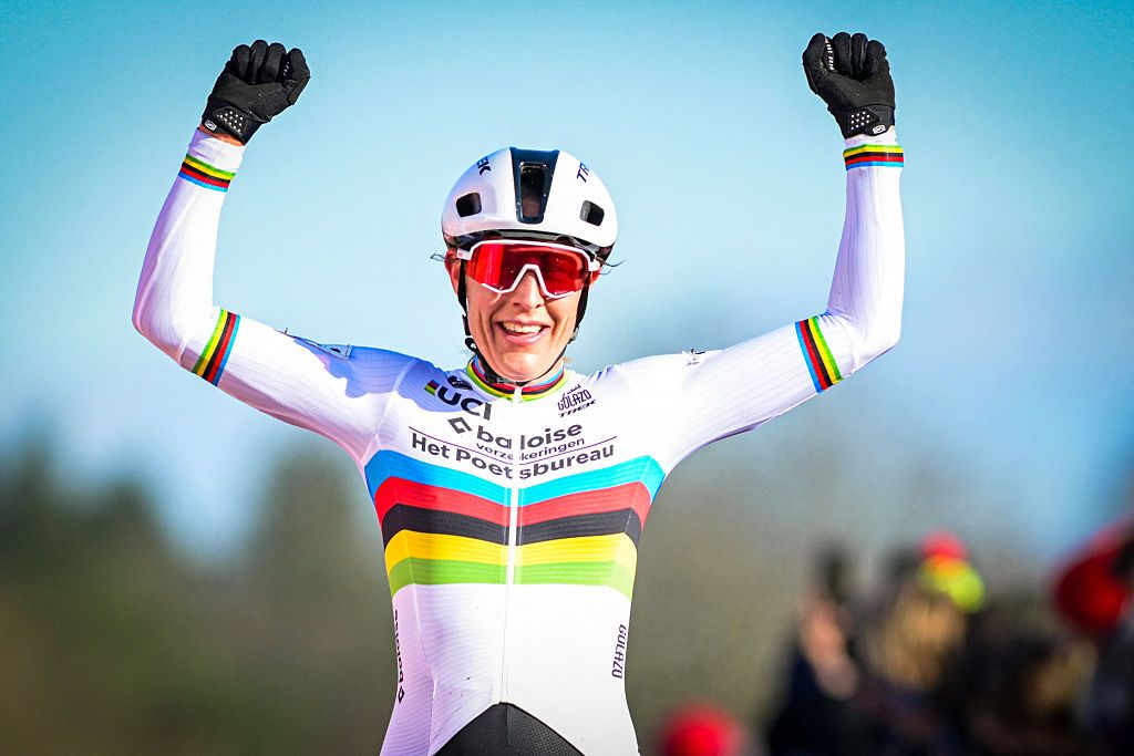 Netherlands' Lucinda Brand celebrates as she crosses the finish line to win the women's elite race of the 'Waaslandcross' cyclo-cross cycling event, stage 7 out of 7 of the Exact Cross competition in Sint-Niklaas on February 14, 2026. (Photo by DAVID PINTENS / Belga / AFP) / Belgium OUT