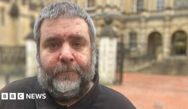 Barry O'Sullivan, who has grey, short hair and a grey, short beard, stood in front of Reading Crown Court. He is wearing a black T-shirt.