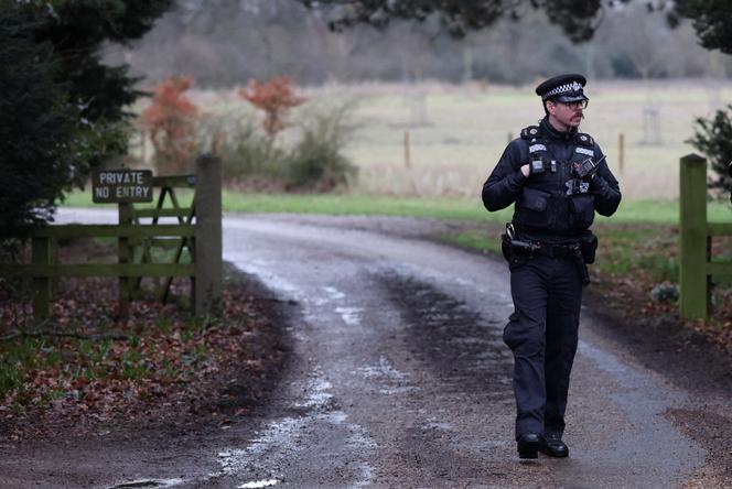 A police officer stands at the entrance to the Wood Farm on the Sandringham Estate, Britain, February 19, 2026.